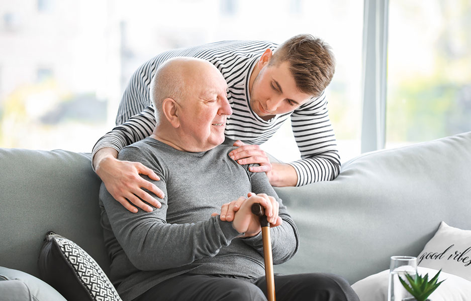 special needs care assistant with man